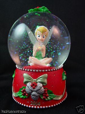 Tinker Bell is holding a snowflake in this  2004 snowglobe